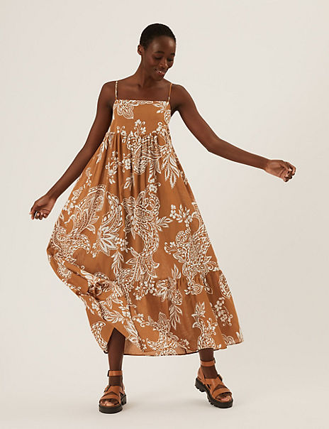 Product When warm weather calls, this pure cotton midaxi dress answers. It's cut in a relaxed fit with a strappy silhouette and tiers through the skirt for a swishable feel. A summer-ready print gives a final flourish. M&S Collection: easy-to-wear wardrobe staples that combine classic and contemporary styles.